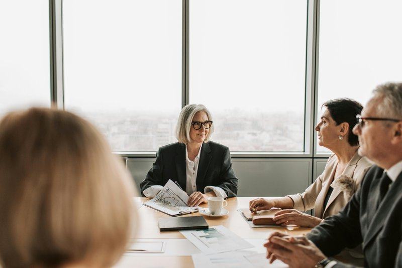 about — image_text image — pexels:executive client advisory meeting boardroom city p