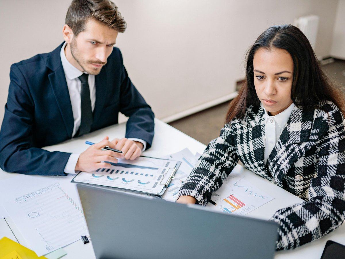 business-partnering-and-capability-building — page_hero background_image — pexels:two finance colleagues office professional collabo