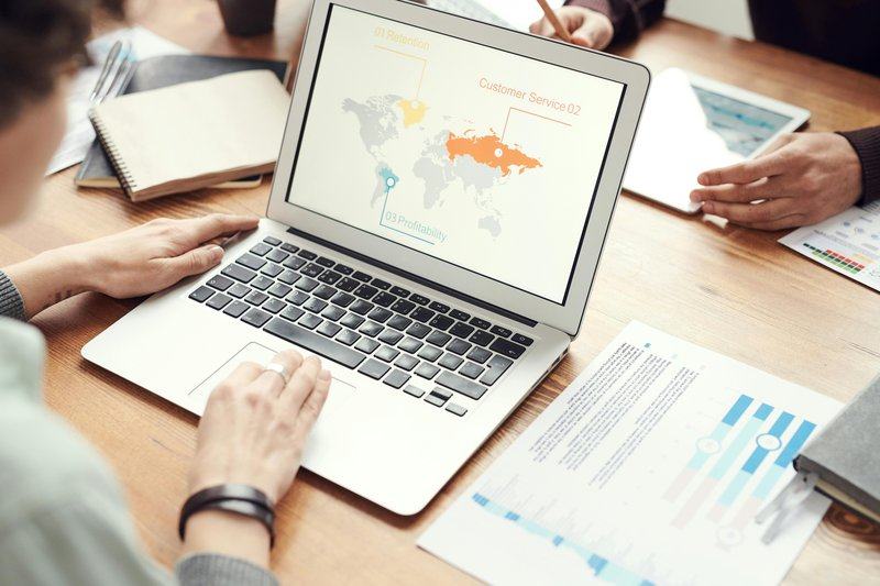 data-and-ai — image_text image — pexels:data analyst laptop collaborative workspace profes