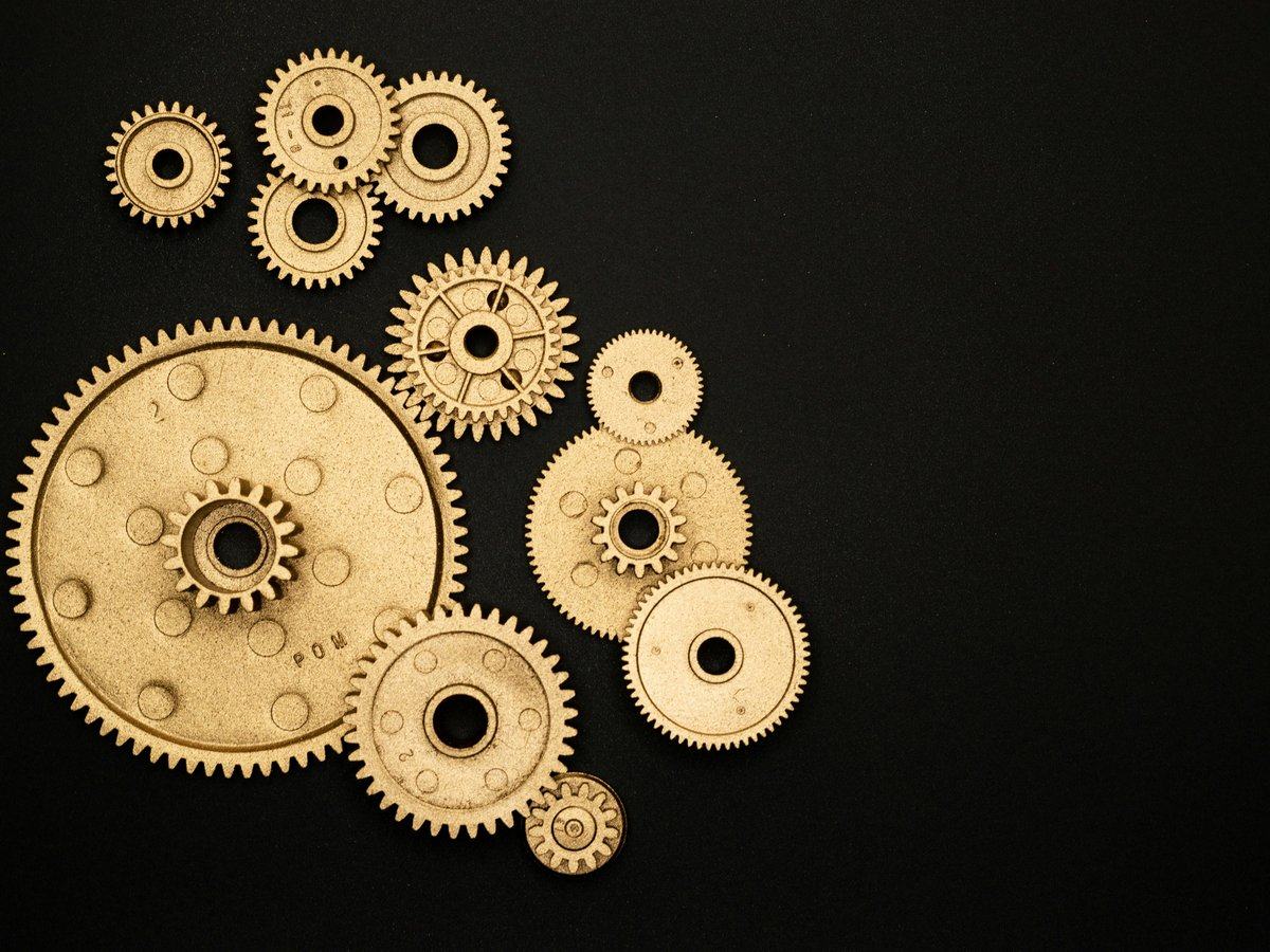 finance-transformation — page_hero background_image — pexels:industrial gears cogs mechanism precision engineer