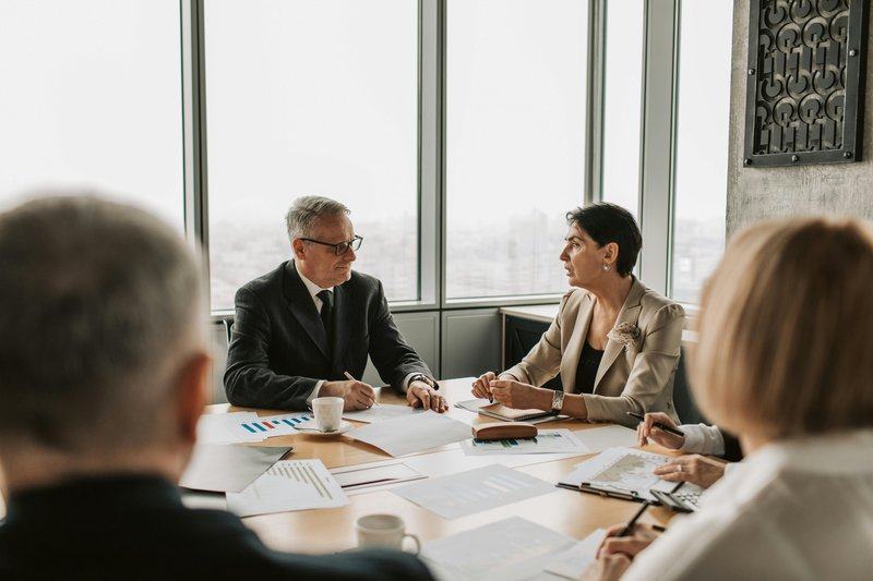 operating-model — image_text image — pexels:service delivery model finance team discussion pro