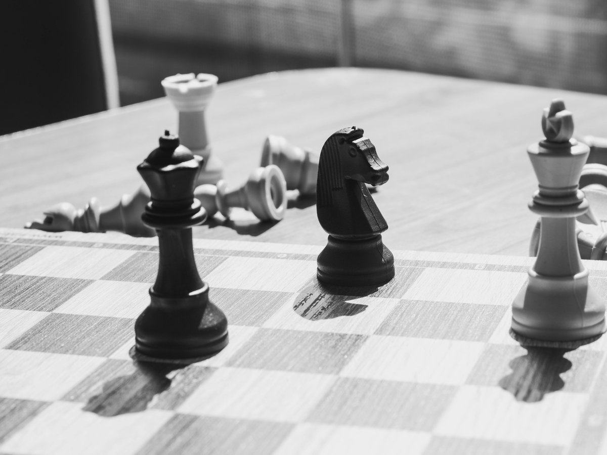 strategic-risks-and-erm — page_hero background_image — pexels:chess board overhead strategic game pieces focus p