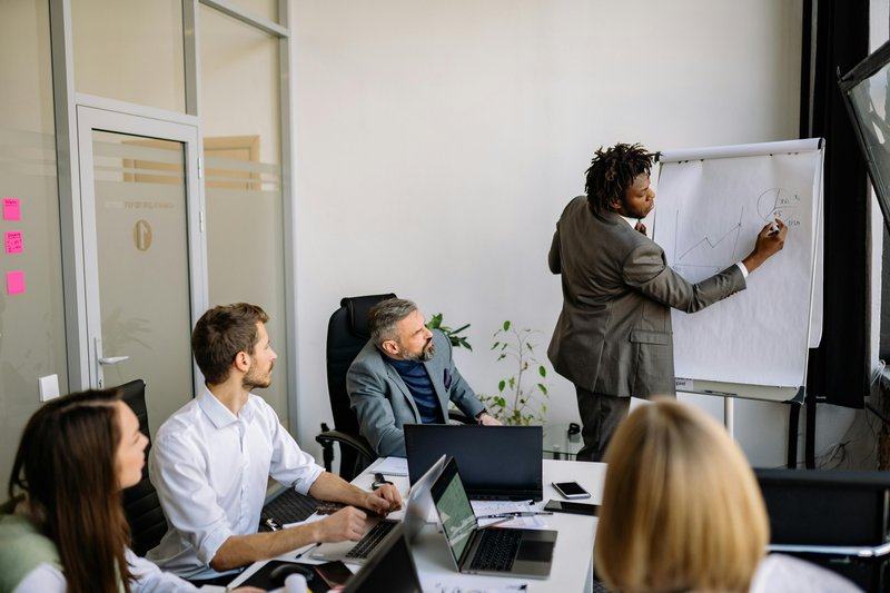 strategy — image_text image — pexels:executive team strategy session conference room le